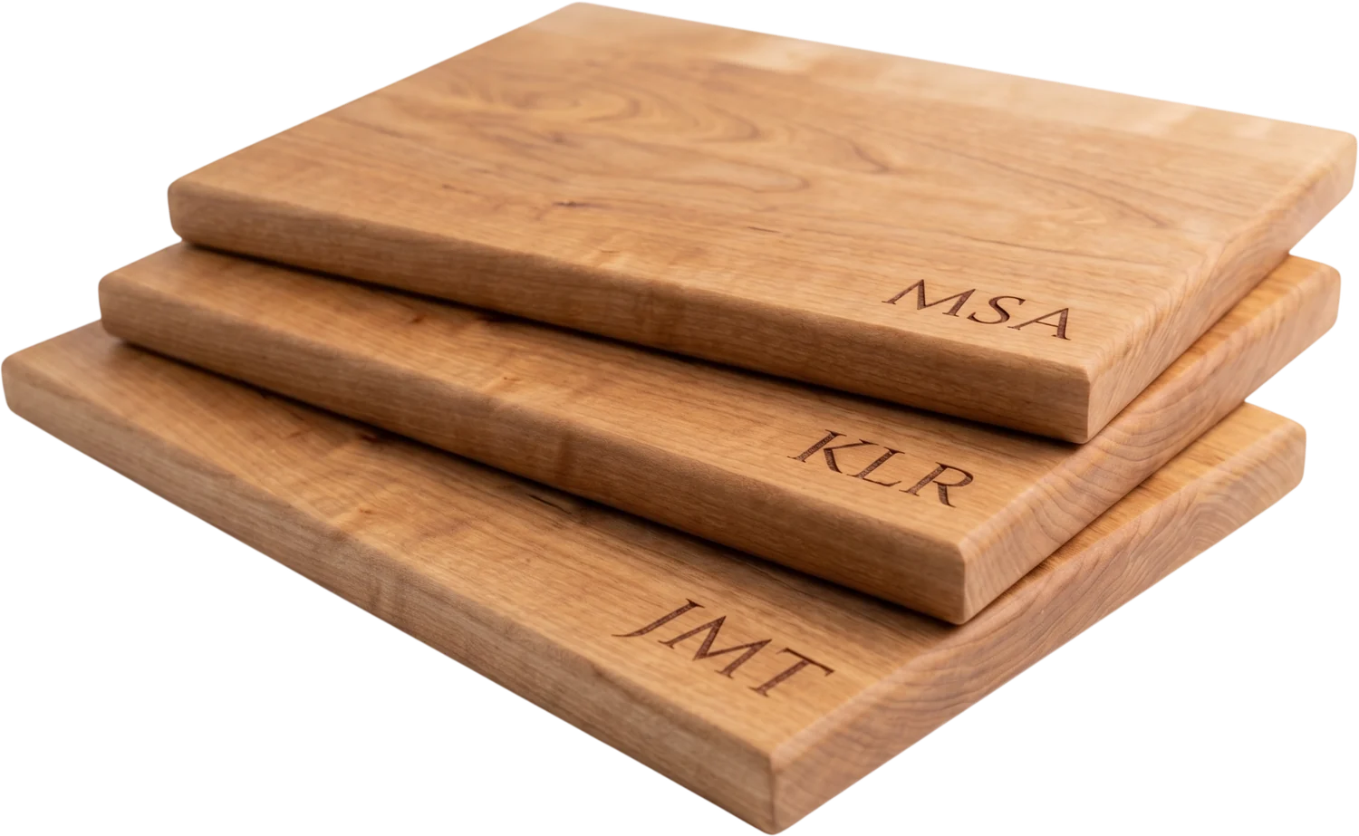 Stack of three engraved cutting boards with monogram initials, Orlando laser engraving
